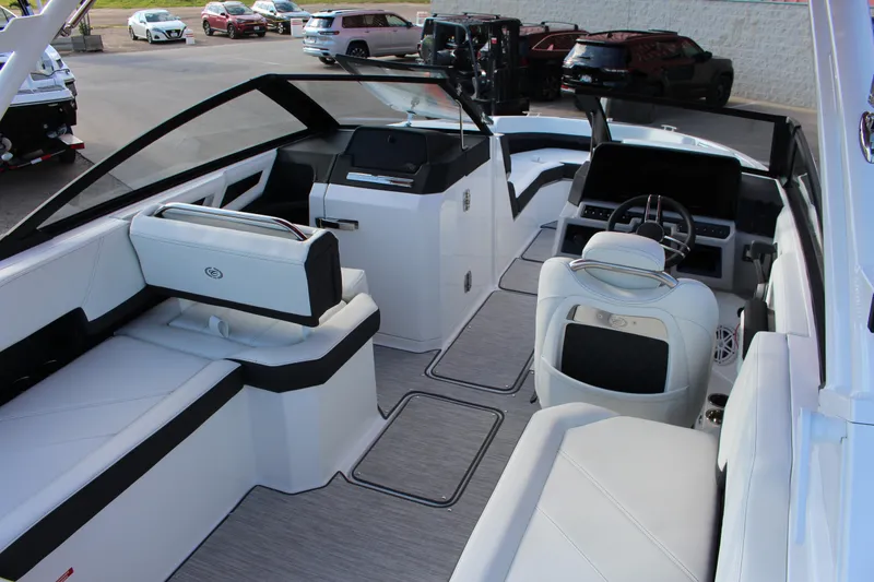 Slide: The Image of 2026 Cobalt R6 boat interior with sleek white seating and modern dashboard design. - 88