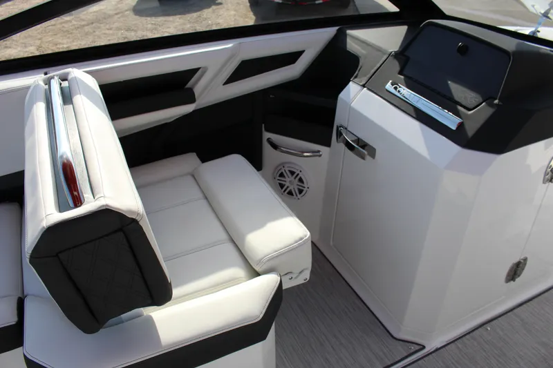 Slide: The Image of 2026 Cobalt R6 boat interior with white seating and modern dashboard design. - 90