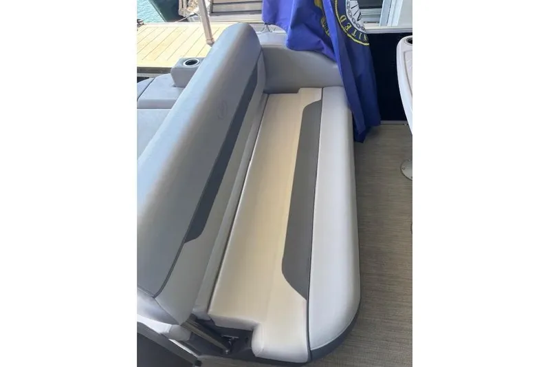 Slide: The Image of 2022 Princecraft Sportfisher 23-2S RL boat interior with comfortable seating and cup holders. - 12