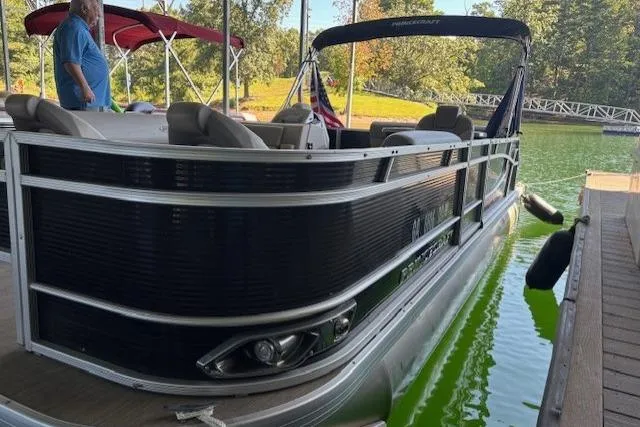 Slide: The Image of 2022 Princecraft Sportfisher 23-2S RL pontoon boat docked on a sunny day. - 20