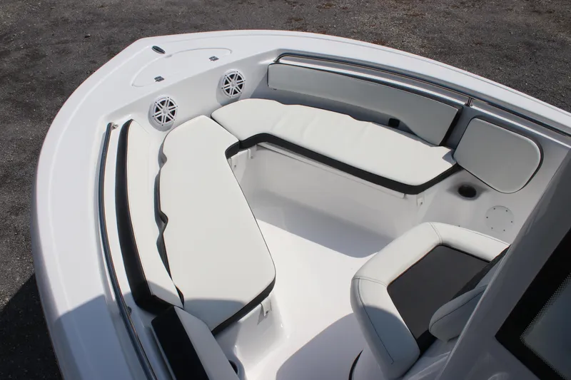 Slide: The Image of 2026 Tidewater 198 CC Adventure boat interior with cushioned seating and speakers. - 4