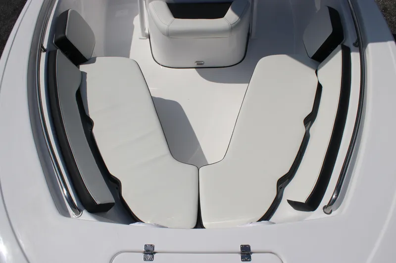 Slide: The Image of 2026 Tidewater 198 CC Adventure boat interior with white cushioned seating. - 5