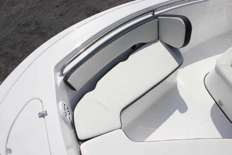 Slide: The Image of 2026 Tidewater 198 CC Adventure boat interior with white cushioned seating. - 6