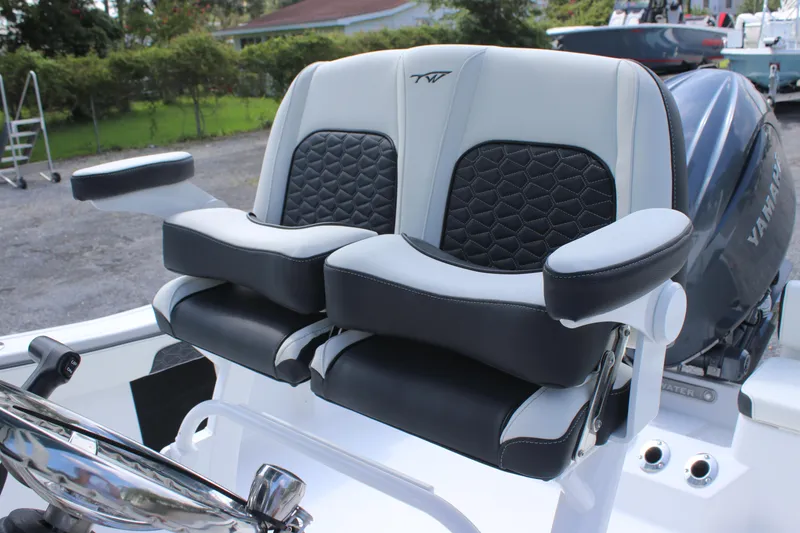 Slide: The Image of 2026 Tidewater 198 CC Adventure boat seats with armrests and stylish design. - 7
