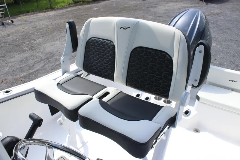 Slide: The Image of 2026 Tidewater 198 CC Adventure boat seats with black and white upholstery. - 8