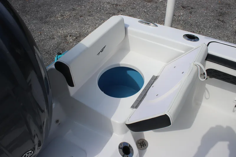 Slide: The Image of 2026 Tidewater 198 CC Adventure boat interior with seating and storage compartment. - 9