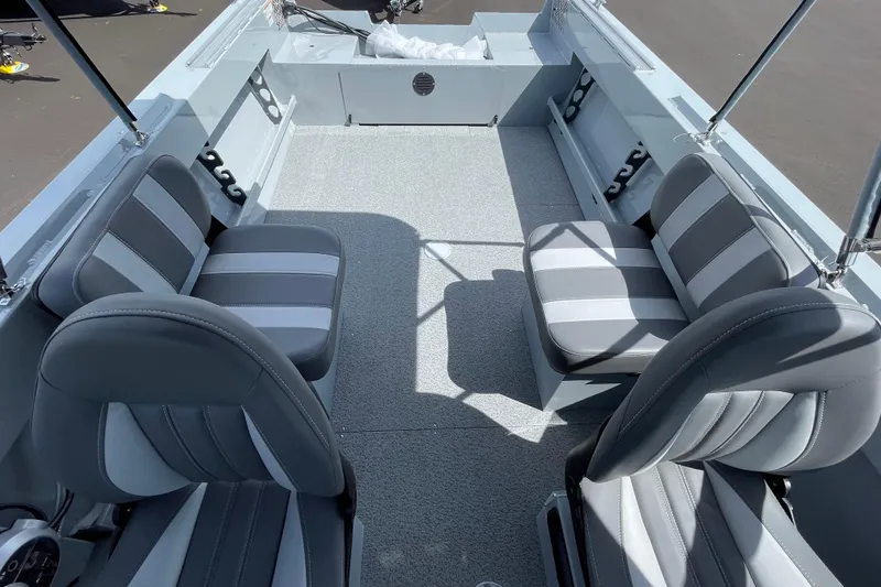 Slide: The Image of 2026 Hewescraft 180 Sportsman interior with gray and white seating, spacious layout. - 11
