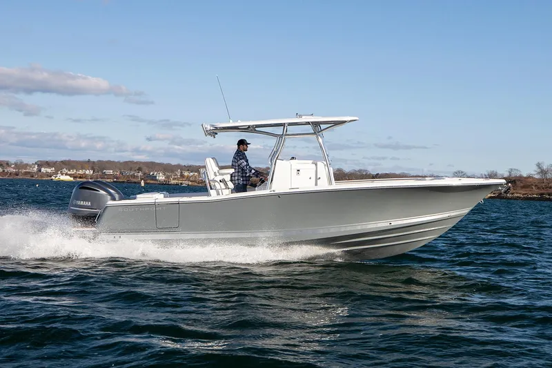 The Image of 2026 Southport 27 FE boat cruising on open water under clear skies. - 0