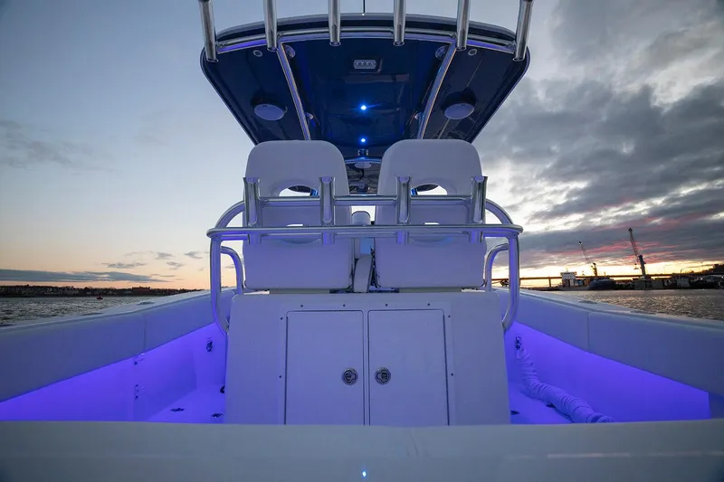 Slide: The Image of 2026 Southport 27 FE boat interior with blue LED lighting at sunset. - 5