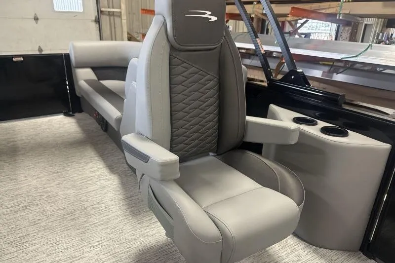 Slide: The Image of 2026 Bennington 22 SSR boat interior with luxurious gray seating and cup holders. - 10