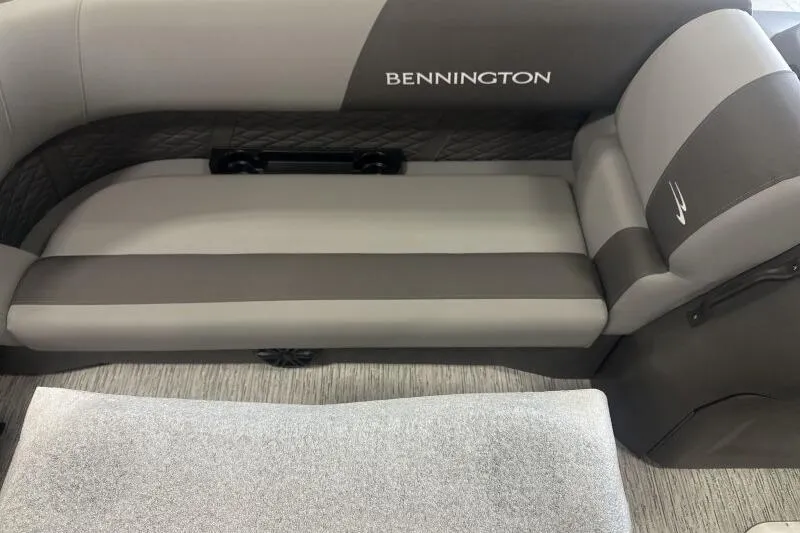Slide: The Image of 2026 Bennington 22 SSR boat interior with gray and brown seating. - 11
