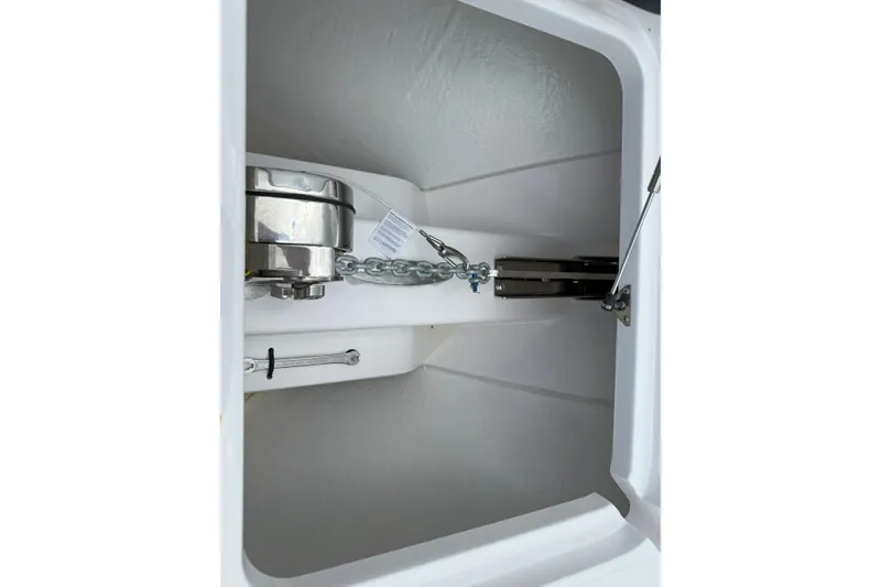 Slide: The Image of Anchor storage compartment of 2026 Southport 30 FE boat, featuring chain and winch. - 19