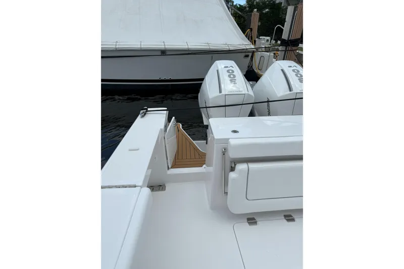 Slide: The Image of 2026 Southport 30 FE boat with twin outboard engines docked at marina. - 3