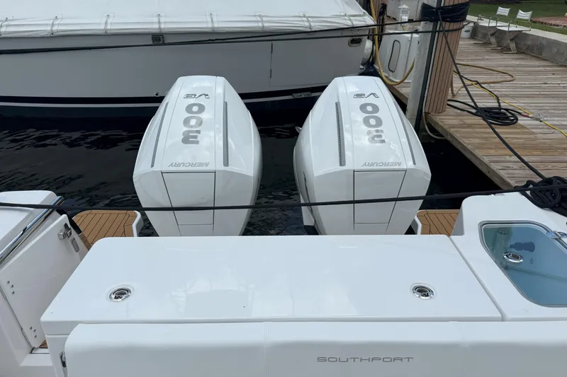 Slide: The Image of 2026 Southport 30 FE boat with twin Mercury 800 V8 engines docked at marina. - 7