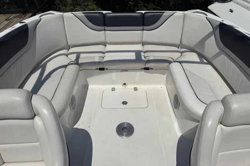 Slide: The Image of 2006 Yamaha Boats AR230 HO interior with white cushioned seating. - 10