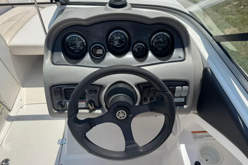 Slide: The Image of 2006 Yamaha Boats AR230 HO dashboard with steering wheel and instrument panel. - 8