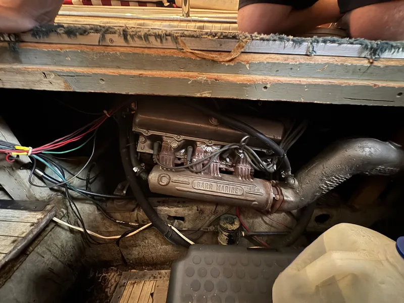 Slide: The Image of 1963 Hatteras Sport Fisherman engine compartment with visible wiring and Barr Marine components. - 21