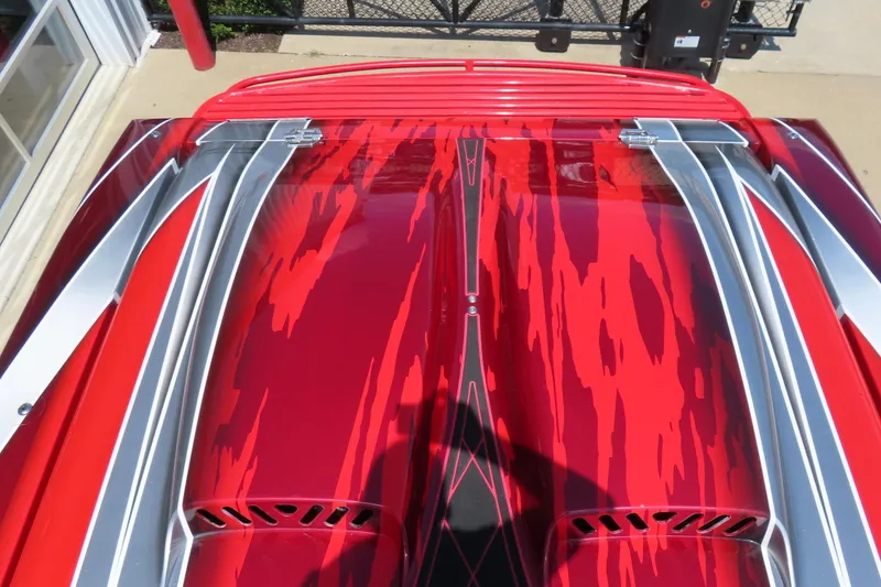 Slide: The Image of 2004 Outerlimits 42 Legacy boat with vibrant red and silver paint design. - 15