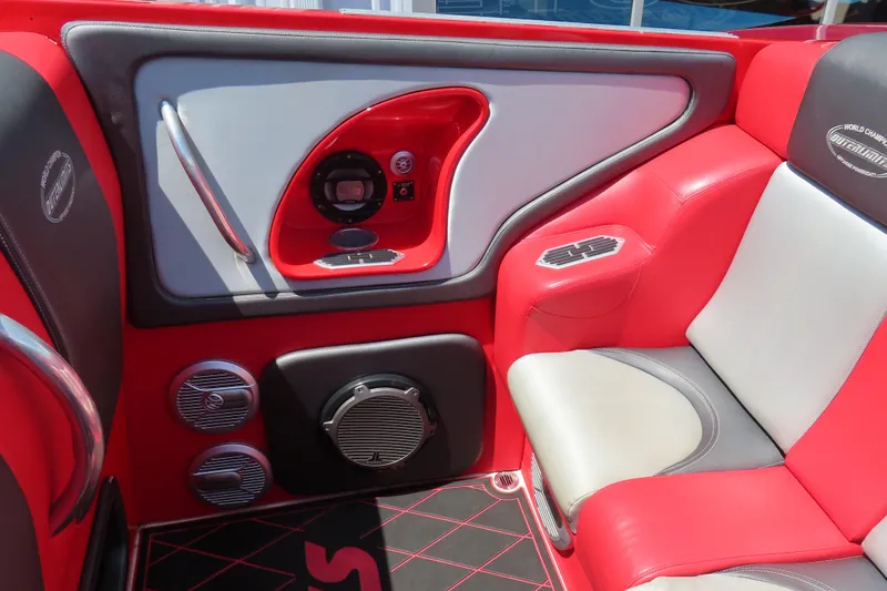 Slide: The Image of Interior of 2004 Outerlimits 42 Legacy boat with red and gray seating and audio system. - 30