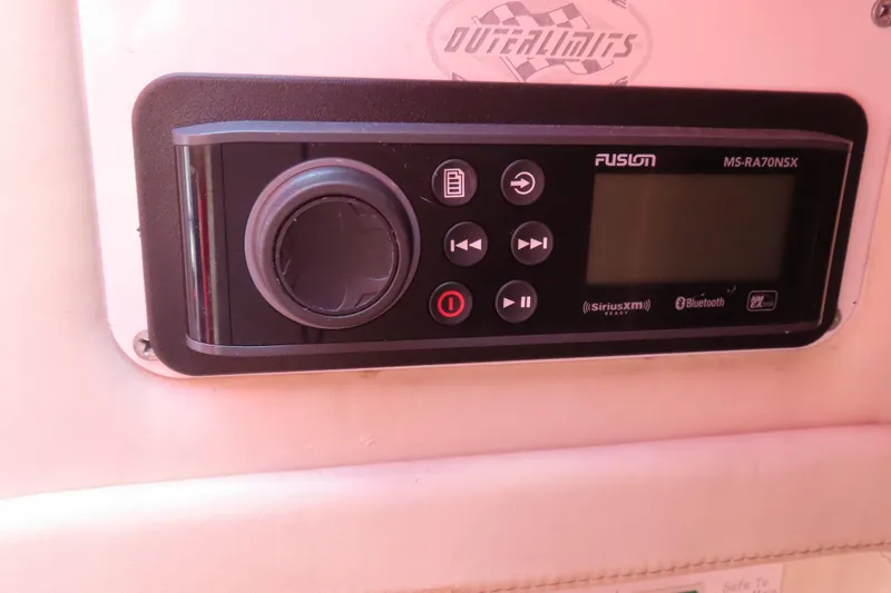 Slide: The Image of Fusion MS-RA70NSX stereo system on 2004 Outerlimits 42 Legacy boat dashboard. - 32