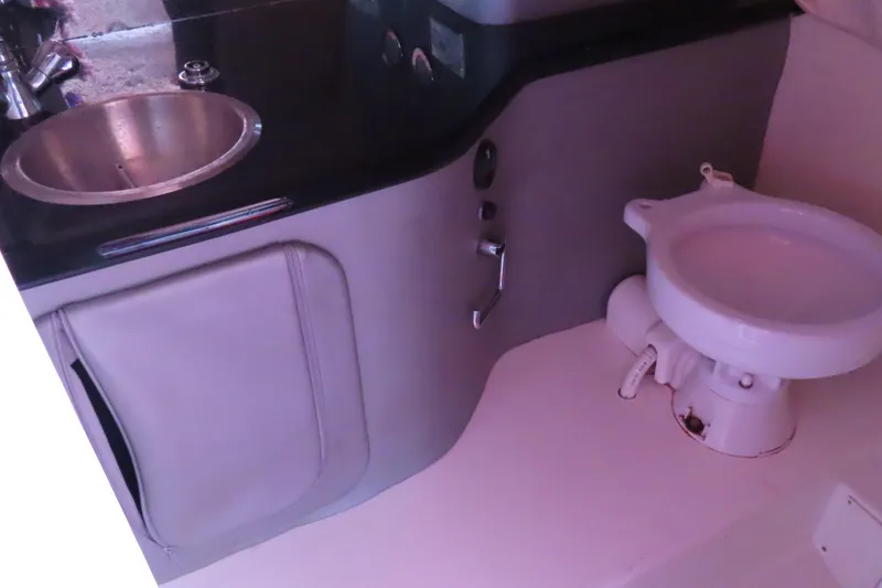Slide: The Image of 2004 Outerlimits 42 Legacy boat bathroom with sink and toilet. - 34