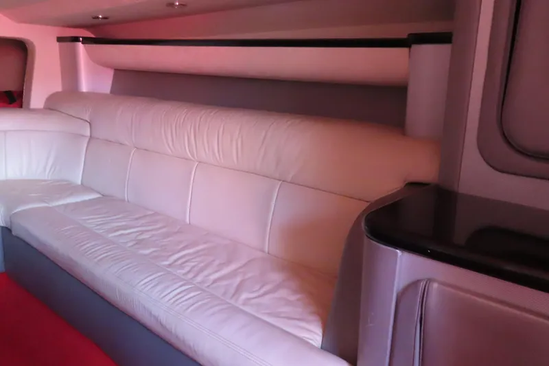 Slide: The Image of Luxurious interior of 2004 Outerlimits 42 Legacy boat with white leather seating. - 36