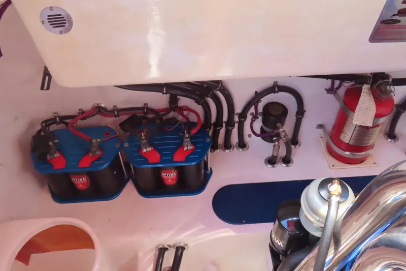 Slide: The Image of 2004 Outerlimits 42 Legacy engine compartment with batteries and fire extinguisher. - 7