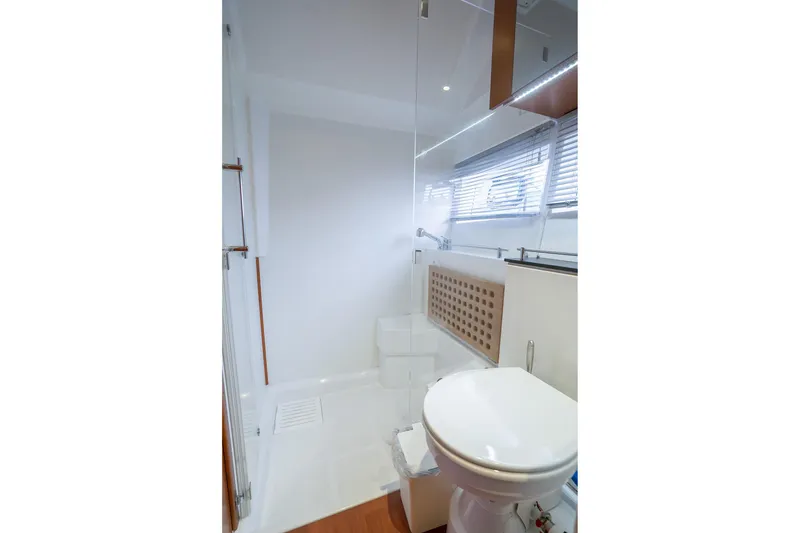 Slide: The Image of Bathroom interior of 2014 Jeanneau NC 14 yacht, featuring modern fixtures and sleek design. - 38