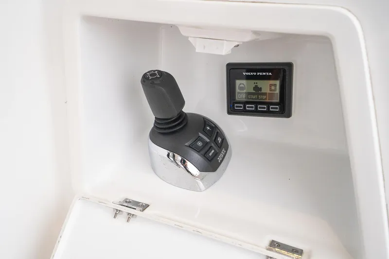 Slide: The Image of Joystick control and display panel on a 2014 Jeanneau NC 14 boat. - 53