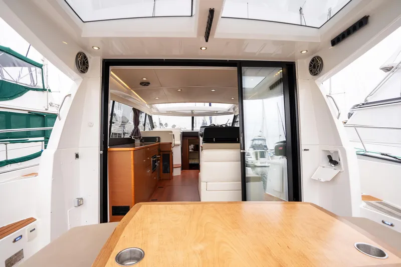 Slide: The Image of 2014 Jeanneau NC 14 yacht interior with modern design and spacious seating area. - 8