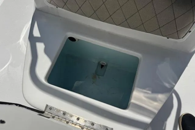 Slide: The Image of 2023 Sportsman Tournament 214 SBX Bay Boat livewell with cushioned seating. - 10