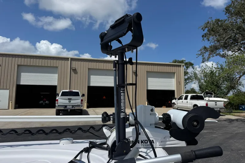 Slide: The Image of 2023 Sportsman Tournament 214 SBX Bay Boat with Minn Kota trolling motor in parking lot. - 18