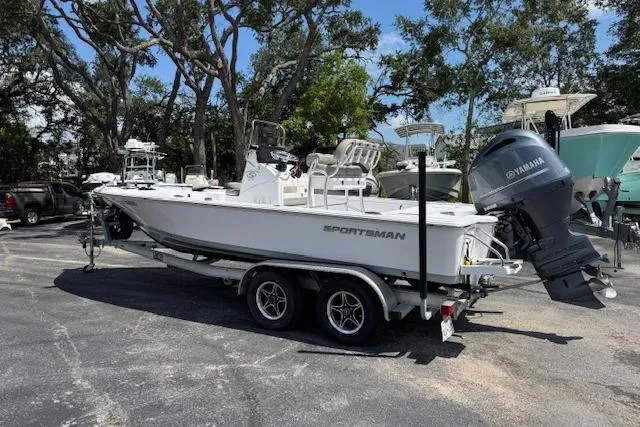 Slide: The Image of 2023 Sportsman Tournament 214 SBX Bay Boat on trailer, parked outdoors. - 5
