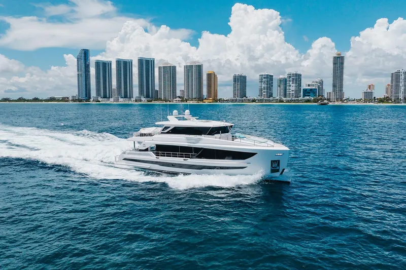 The Image of Luxury Horizon 2021 yacht cruising near city skyline under blue sky. - 1