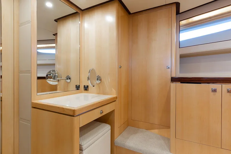 Slide: The Image of Luxurious yacht interior with wooden cabinetry and vanity, Horizon 2021 model. - 16