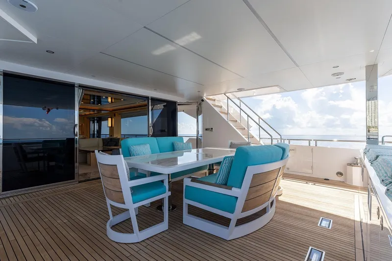 Slide: The Image of Luxurious Horizon 2021 yacht deck with turquoise seating and ocean view. - 2