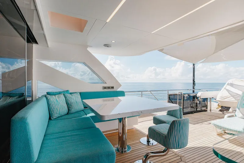 Slide: The Image of Luxurious Horizon 2021 yacht deck with turquoise seating, ocean view, and modern design. - 21