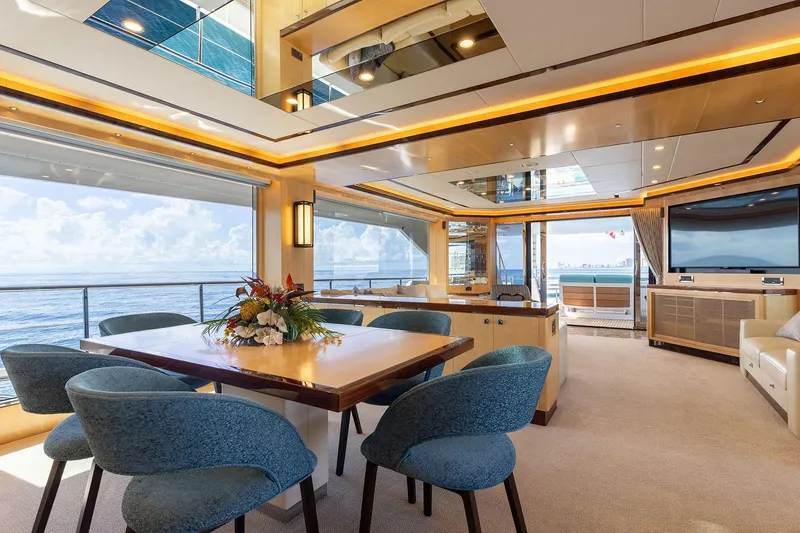 Slide: The Image of Luxurious Horizon 2021 yacht interior with elegant dining area, ocean view, and modern decor. - 4