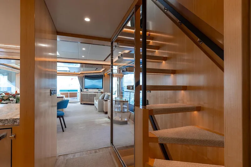 Slide: The Image of Luxurious Horizon 2021 yacht interior with modern staircase and elegant living area. - 9