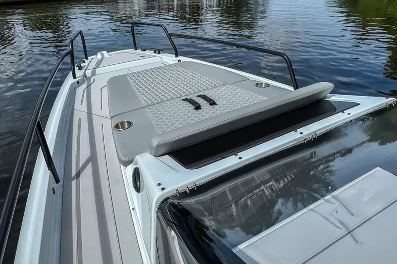 Slide: The Image of 2023 BRABUS Shadow 300 XT boat deck with sleek design on calm water. - 15