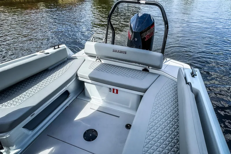 Slide: The Image of 2023 BRABUS Shadow 300 XT boat interior with luxurious seating and powerful engine. - 9
