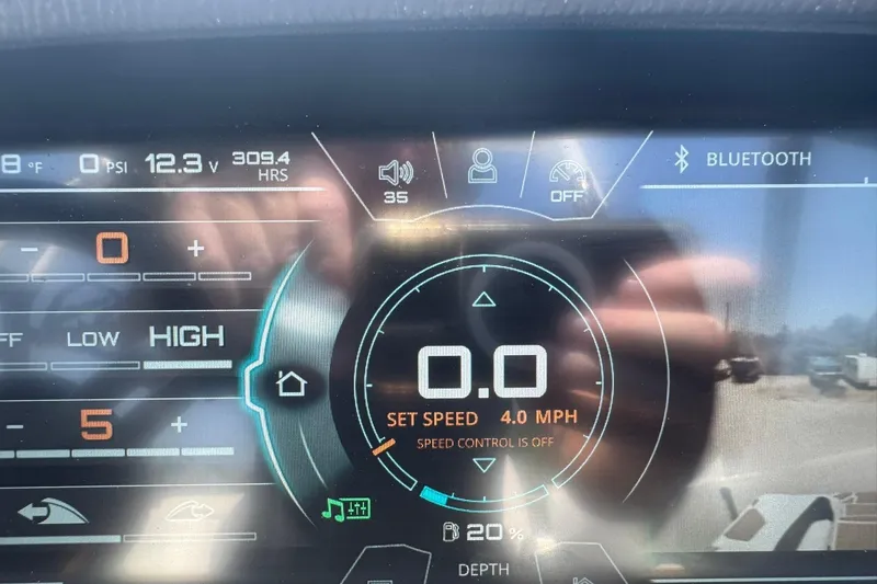 Slide: The Image of Dashboard of a 2017 Nautique Super Air Nautique G23 boat, displaying speed and settings. - 13