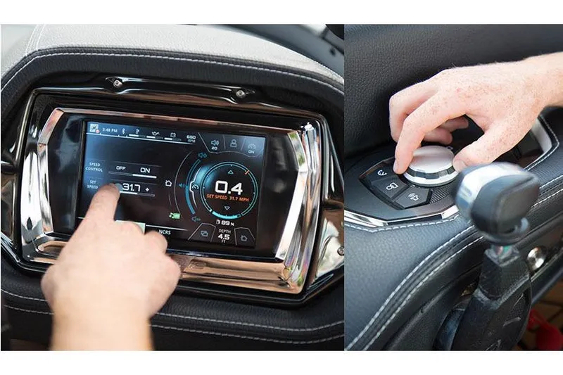 Slide: The Image of Manufacturer Provided Image: 2016 Nautique Super Air G23 dashboard touchscreen and control knob in use. - 18