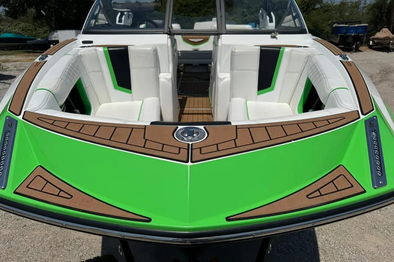 Slide: The Image of 2017 Nautique Super Air Nautique G23 boat with vibrant green and white interior. - 5