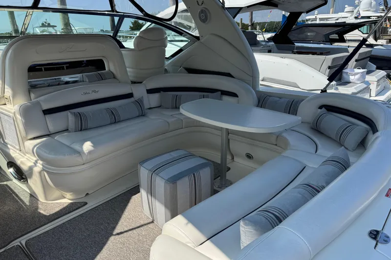 Slide: The Image of Luxurious interior of 2003 Sea Ray 420 Sundancer yacht with plush seating and table. - 10