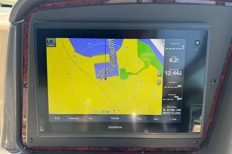 Slide: The Image of Garmin navigation display on 2003 Sea Ray 420 Sundancer, showing nautical chart and vessel data. - 19