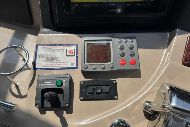 Slide: The Image of Control panel of 2003 Sea Ray 420 Sundancer with navigation and bow thruster controls. - 20