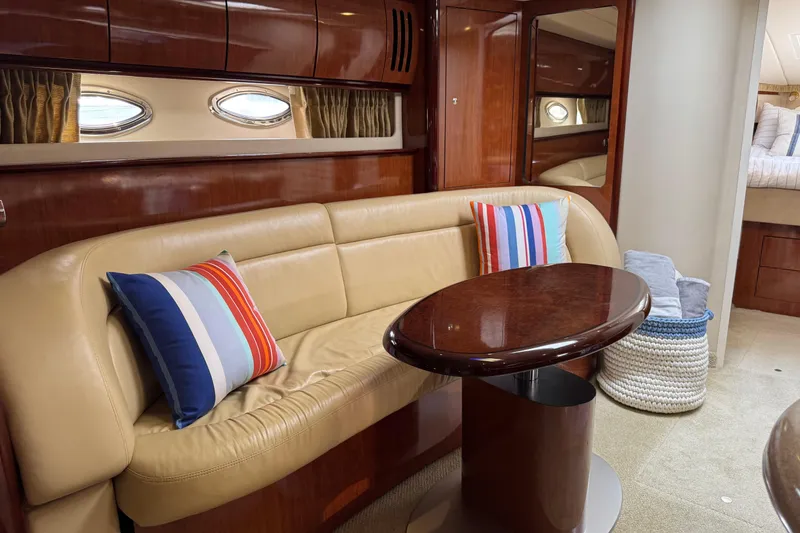 Slide: The Image of Luxurious 2003 Sea Ray 420 Sundancer interior with leather seating and striped pillows. - 22