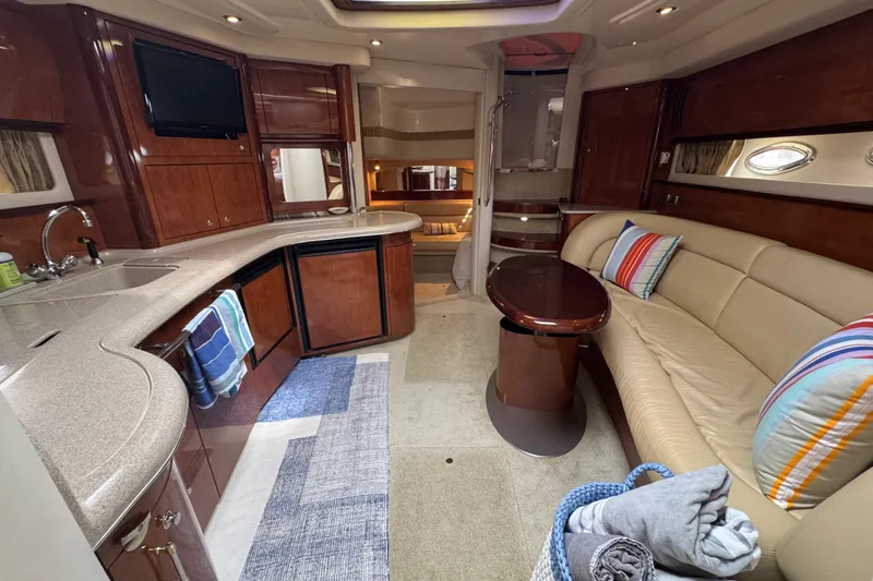Slide: The Image of Luxurious interior of 2003 Sea Ray 420 Sundancer yacht with plush seating and modern amenities. - 25