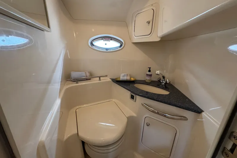 Slide: The Image of Bathroom interior of 2003 Sea Ray 420 Sundancer yacht, featuring compact design and modern amenities. - 31